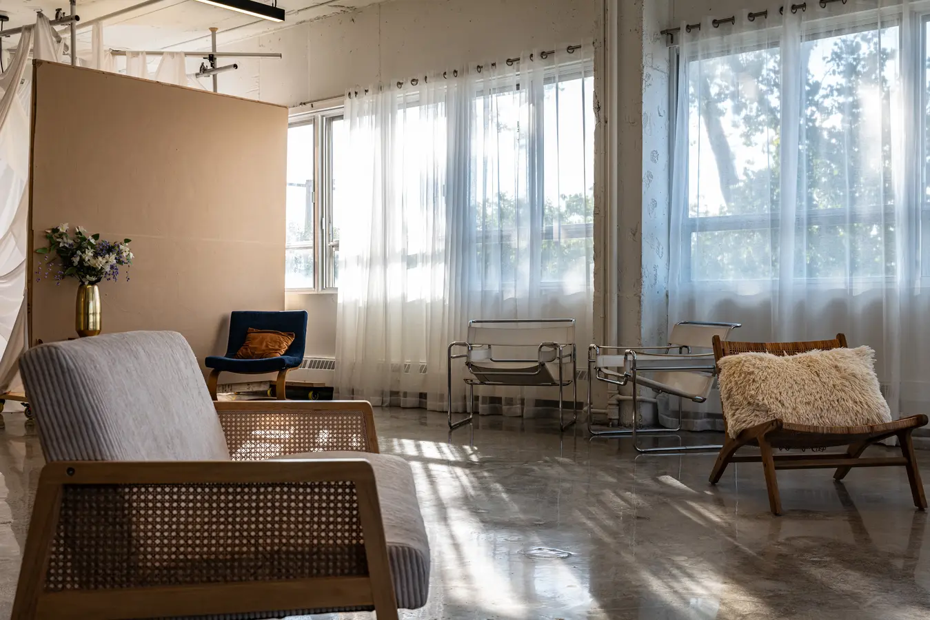 Rattan armchair and beige backdrop