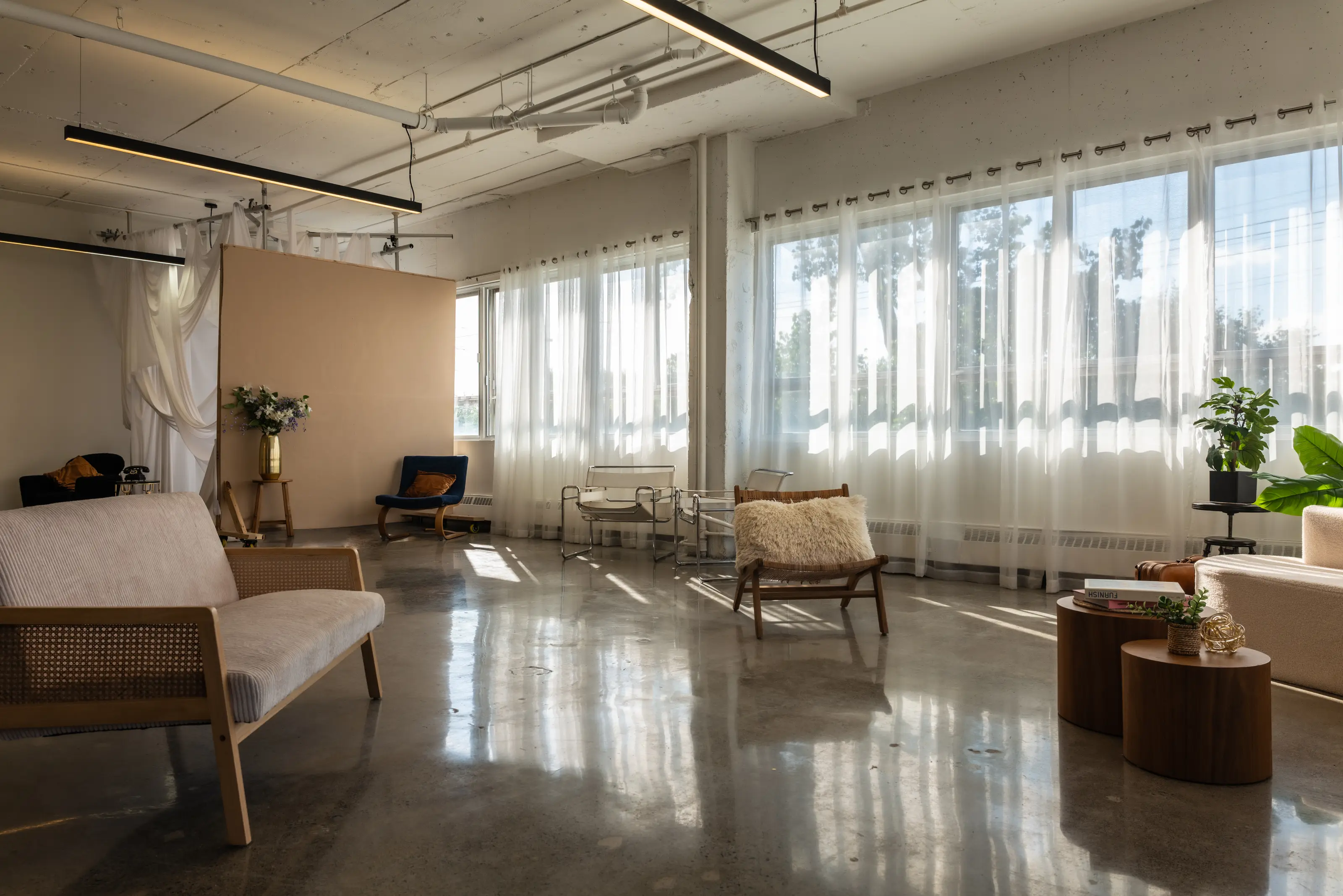 Studio A at Espace Urbain Studio in Montreal, a large bright space with sets and sheer curtains